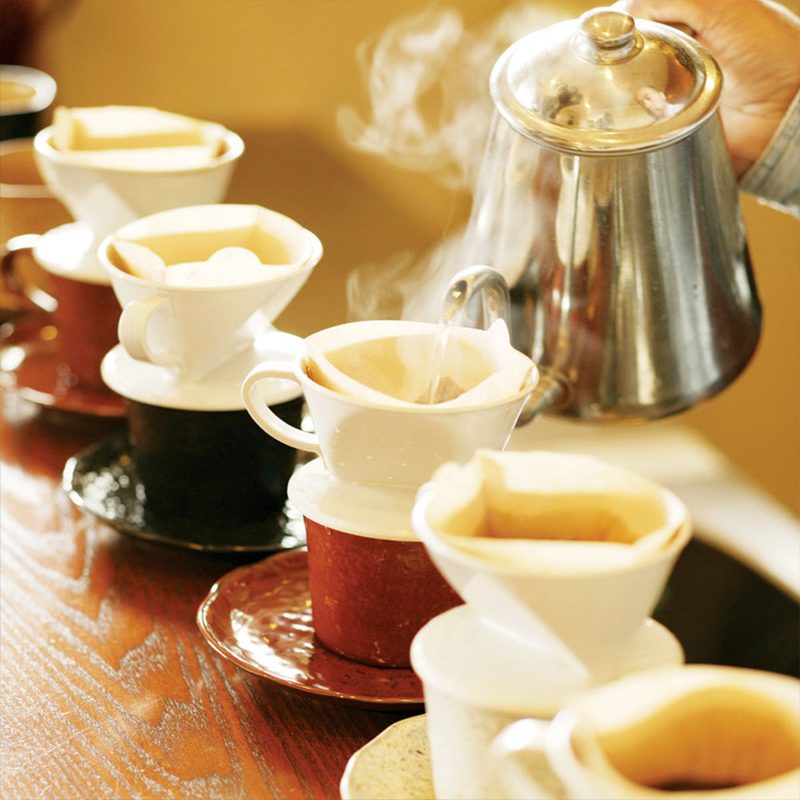 Pouring hot water into teacups