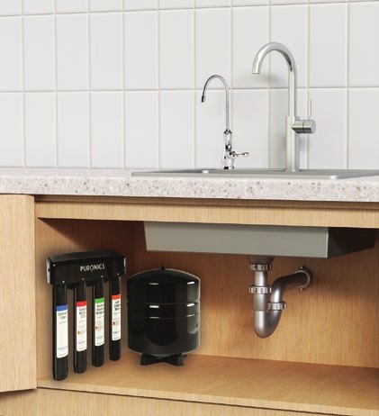 Micromax 8500 installed under a kitchen sink beside the storage tank, with the dedicated faucet above